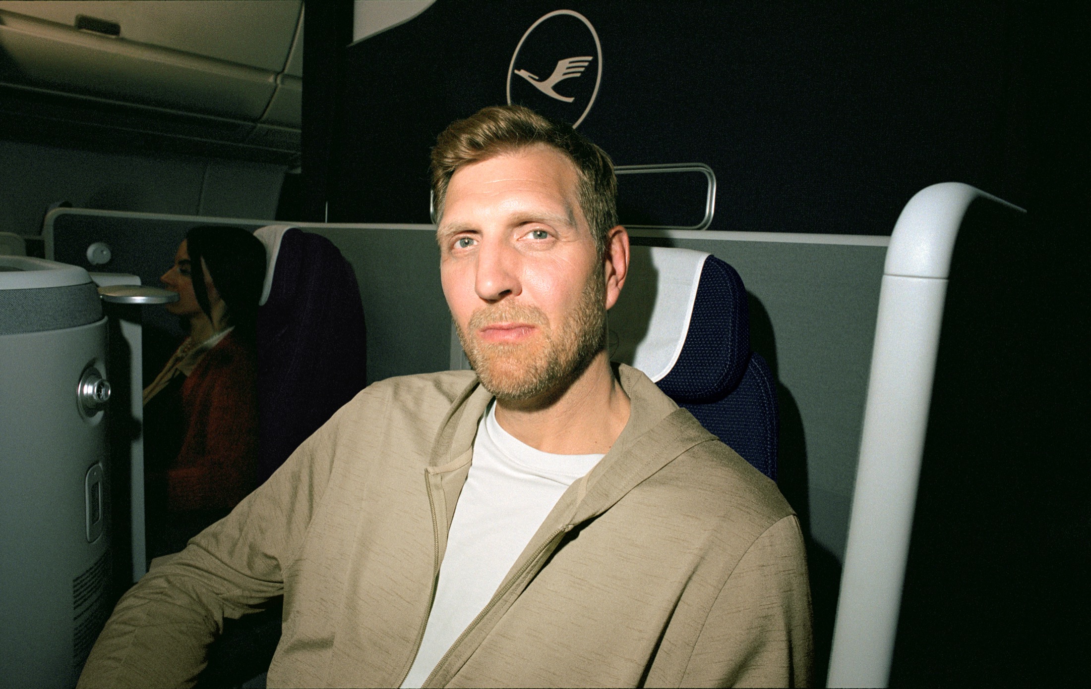 Dirk Nowitzki seated inside the Lufthansa Allegris cabin.